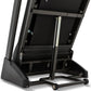 Black Spirit XT185 treadmill with open hood showing internal mechanics, metal frame, black running belt, and wheeled base on 