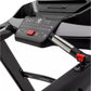 Black and gray treadmill console with red emergency stop button and numeric keypad controls on white background