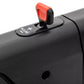 Black treadmill with red and black emergency stop clip mounted on handrail