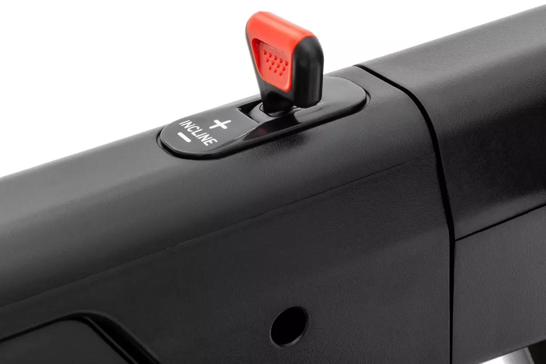 Black treadmill with red and black emergency stop clip mounted on handrail