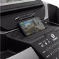Smartphone displaying racing game mounted on black Spirit XT685ENT treadmill console with control panel visible