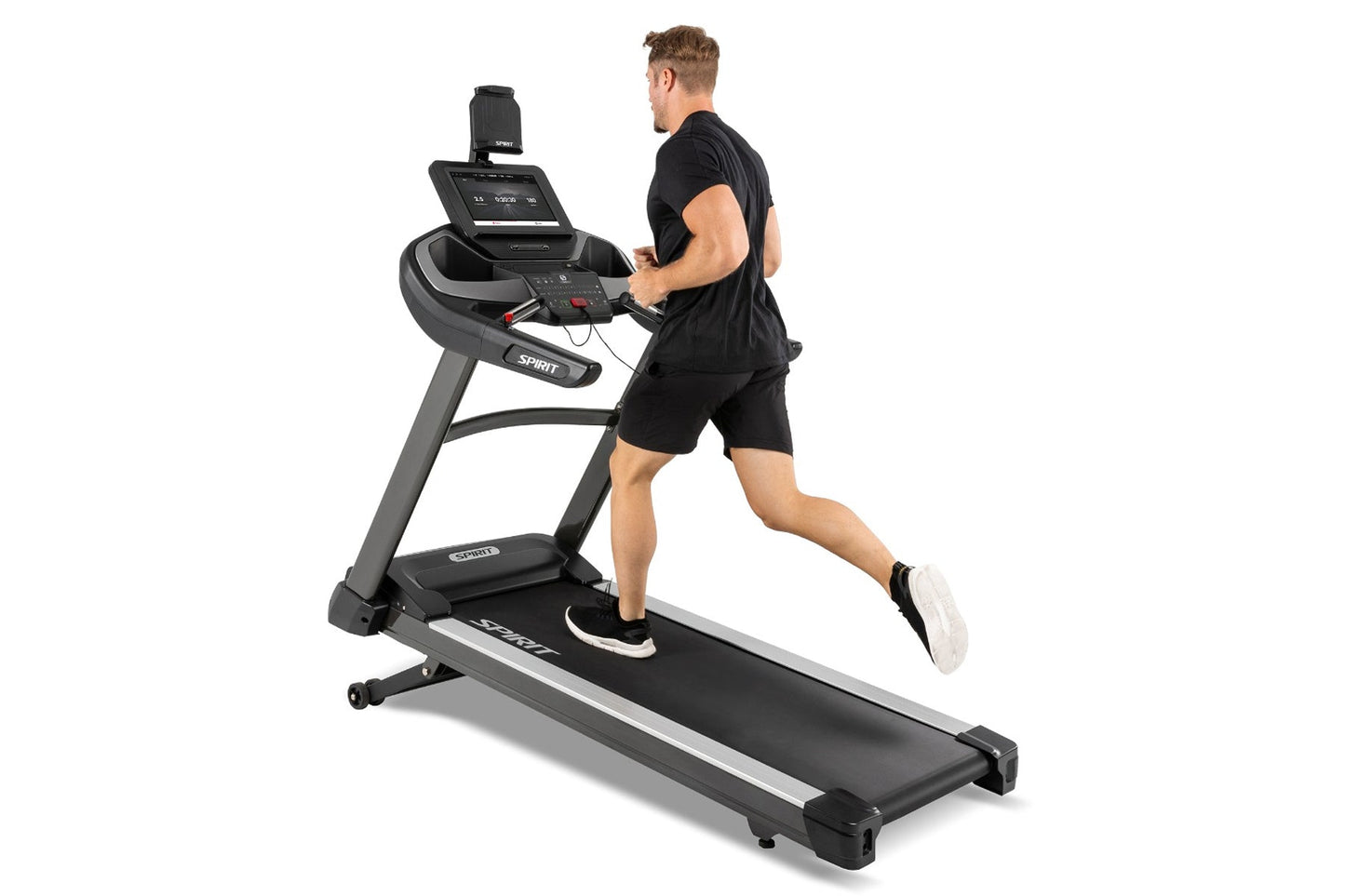 Spirit XT685ENT black and gray treadmill with digital display, worn by male model in black shirt and shorts