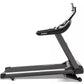 Spirit XT685ENT black treadmill with silver accents and digital display console, shown from side angle on white background
