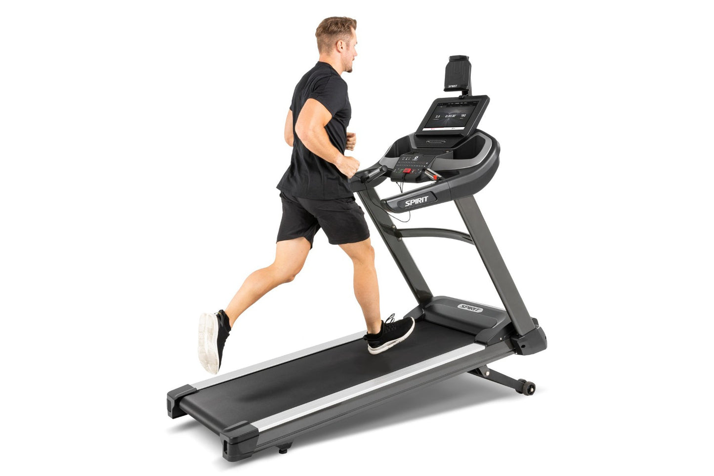 Man running on Spirit XT685ENT black and gray treadmill with digital display monitor, worn by model on white background