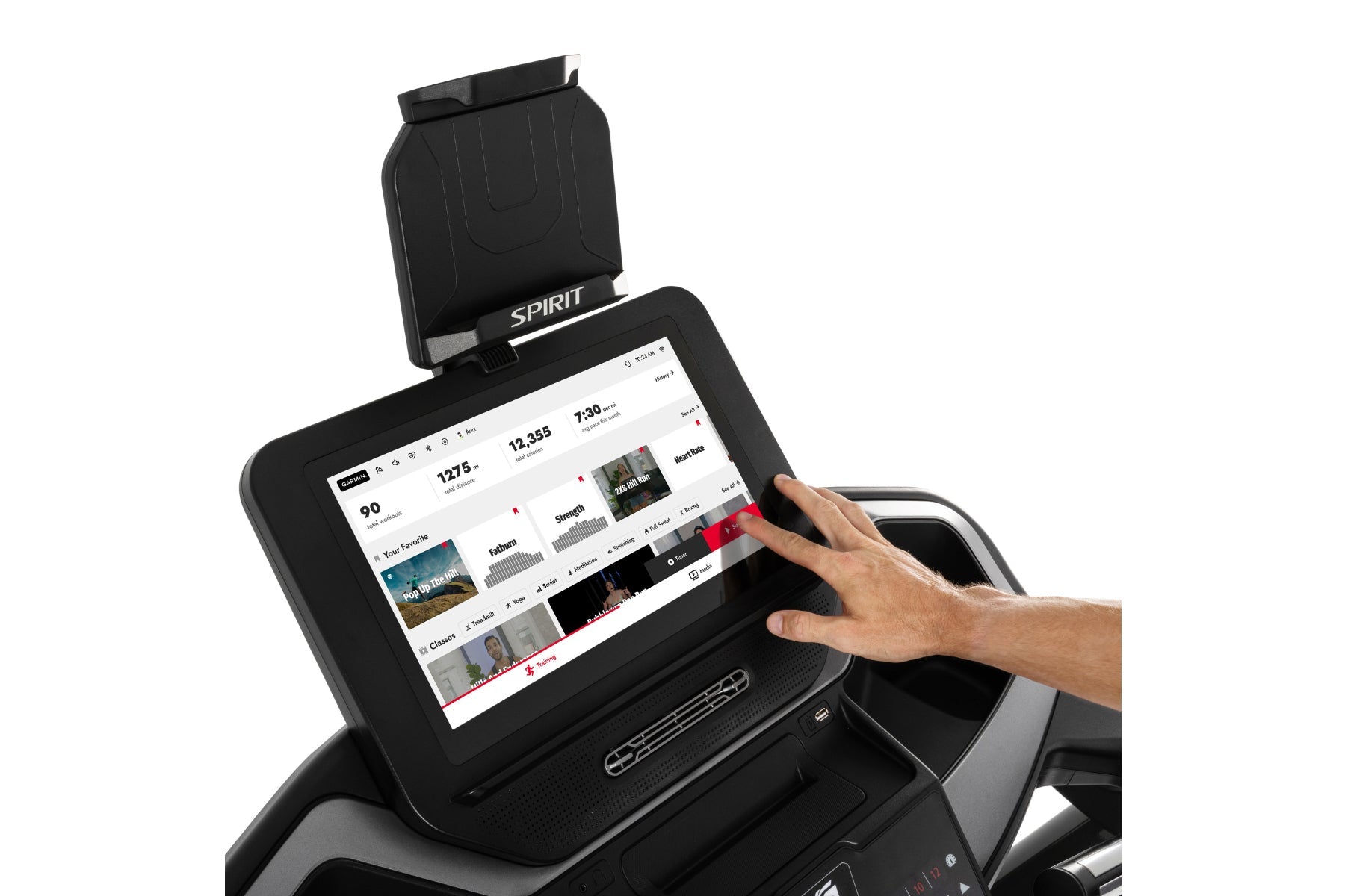 Spirit XT685ENT treadmill with touchscreen console displaying workout metrics, hand interacting with screen, black frame with