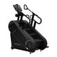 Black StairMaster Gauntlet 10G Stepmill with dual handles, digital display, and textured foot pedals on white background