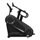 Black StairMaster Gauntlet 10G stepmill with dual wheels, digital display, and handlebar controls on white background