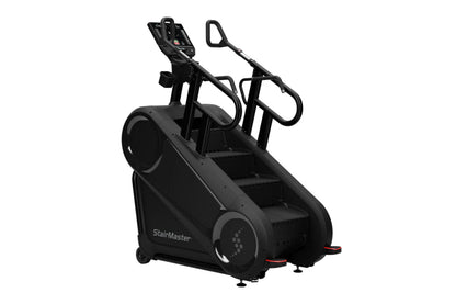 StairMaster Gauntlet 10G black stairclimbing machine with dual handles, digital console, and stepped platform on white backgr