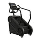 Black StairMaster Gauntlet 4G StepMill with digital console and handrails on white background
