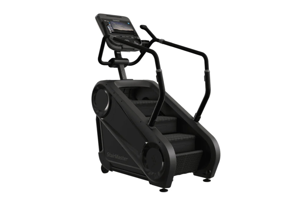 Black StairMaster Gauntlet 4G StepMill with digital console and handrails on white background