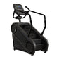 Black StairMaster Gauntlet 4G StepMill with digital display console, handrails, and stepped platform on white background