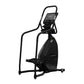 Black StairMaster 8-FreeClimber stair climbing exercise machine with digital display console and handrails on white backgroun
