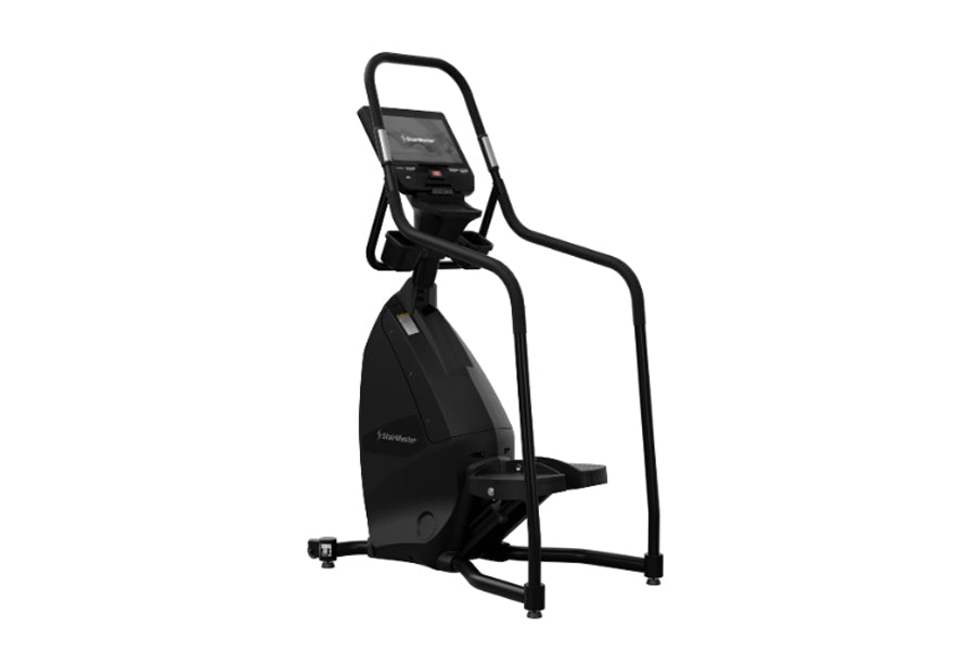 Black StairMaster 8-FreeClimber stair climbing machine with digital console and foot pedals on white background