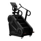 Black StairMaster 8Gx Gauntlet stair stepper with digital display, handrails, and stepped platform on white background