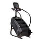 Black StairMaster Gauntlet 8G StepMill with digital display console, handrails, and stepped climbing surface on white backgro