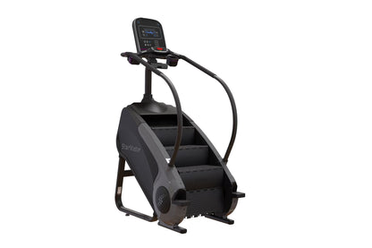 Black StairMaster Gauntlet 8G StepMill with digital display console, handrails, and stepped climbing platform on white backgr