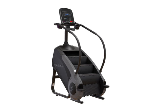 Black StairMaster Gauntlet 8G StepMill with digital display console, handrails, and stepped climbing platform on white backgr