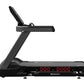 Star Trac 10 Series FreeRunner black treadmill with red digital display and adjustable handrail on white background