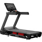 Black Star Trac treadmill with digital display console, cushioned running deck, and red accent lighting on white background