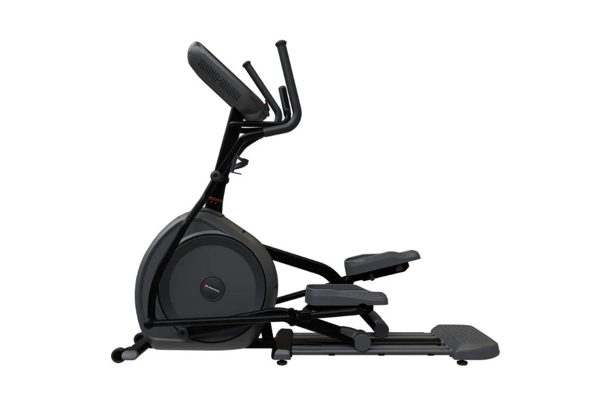 Black elliptical cross trainer with dual handlebar grips, foot pedals, and large front wheel on white background