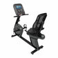 Black and gray recumbent exercise bike with digital touchscreen console, mesh-back seat, and foot pedals on white background