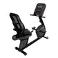 Black and gray recumbent exercise bike with mesh backrest, digital display console, and foot pedals on white background