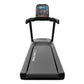 Black Star Trac 4TR treadmill with digital display console, black handles, and gray running deck on white background