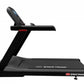 Black Star Trac 4TR treadmill with digital display console, red accents, and wide running deck on white background