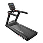 Black Star Trac motorized treadmill with digital console, gray and black frame, red accents, on white background