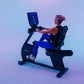Woman using black Star Trac recumbent bike with digital display console on gradient blue and purple background