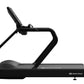 Black Star Trac commercial treadmill with curved running surface, black handles, and digital display on white background