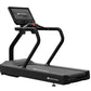 Star Trac 8TR black treadmill with digital display console, cushioned running deck, and dual handrails on white background