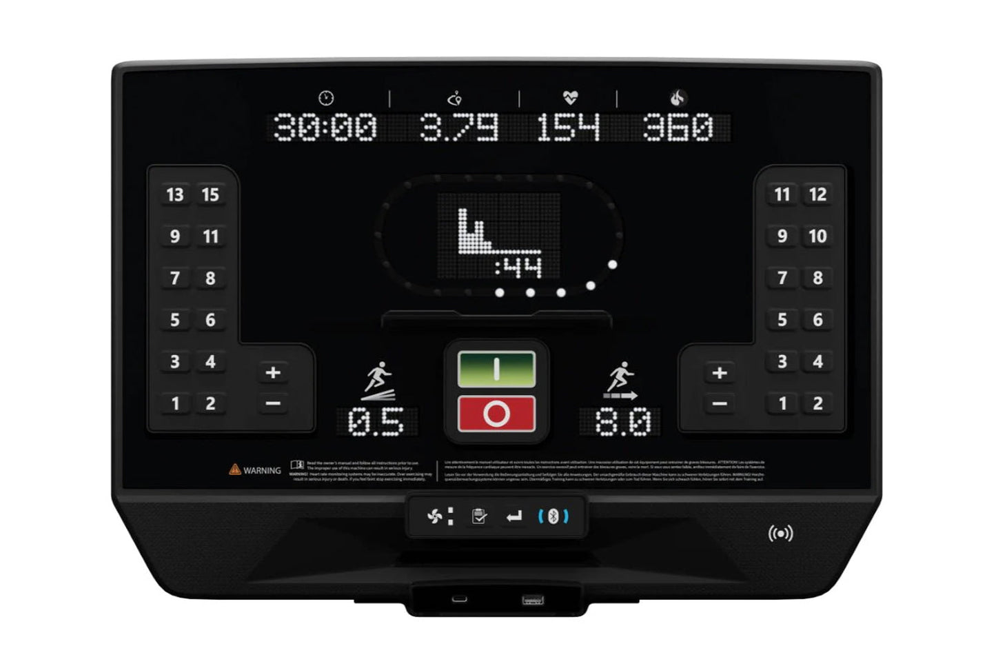 Star Trac 8TR treadmill console display with digital metrics, numeric keypads on sides, and central control buttons on black 