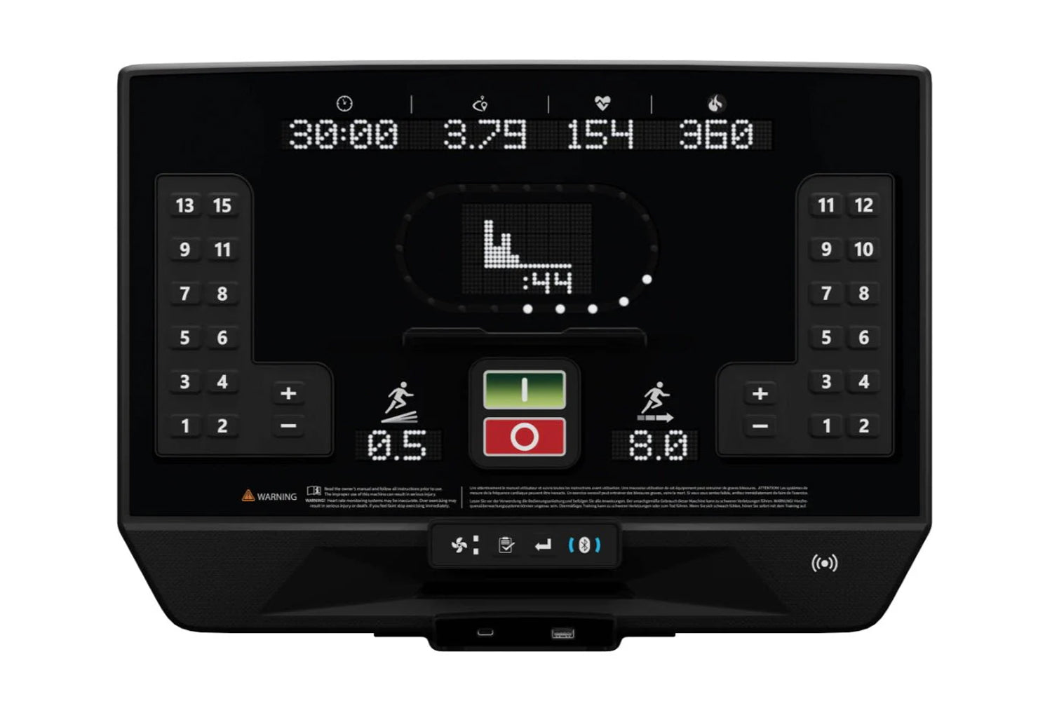Star Trac 8TR treadmill console display with digital metrics, numeric keypads on sides, and central control buttons on black 