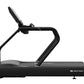 Black Star Trac 8TRx treadmill with curved running deck and upright console, shown on white background
