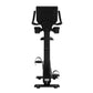 Black upright exercise bike with digital display console, dual handle bars, and pedals with foot straps on white background