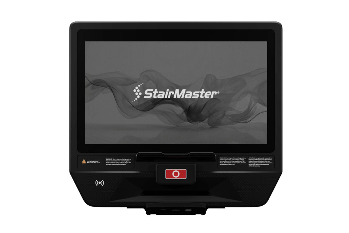 StairMaster black elliptical machine with touchscreen display showing logo, red start button, and control panel on white back