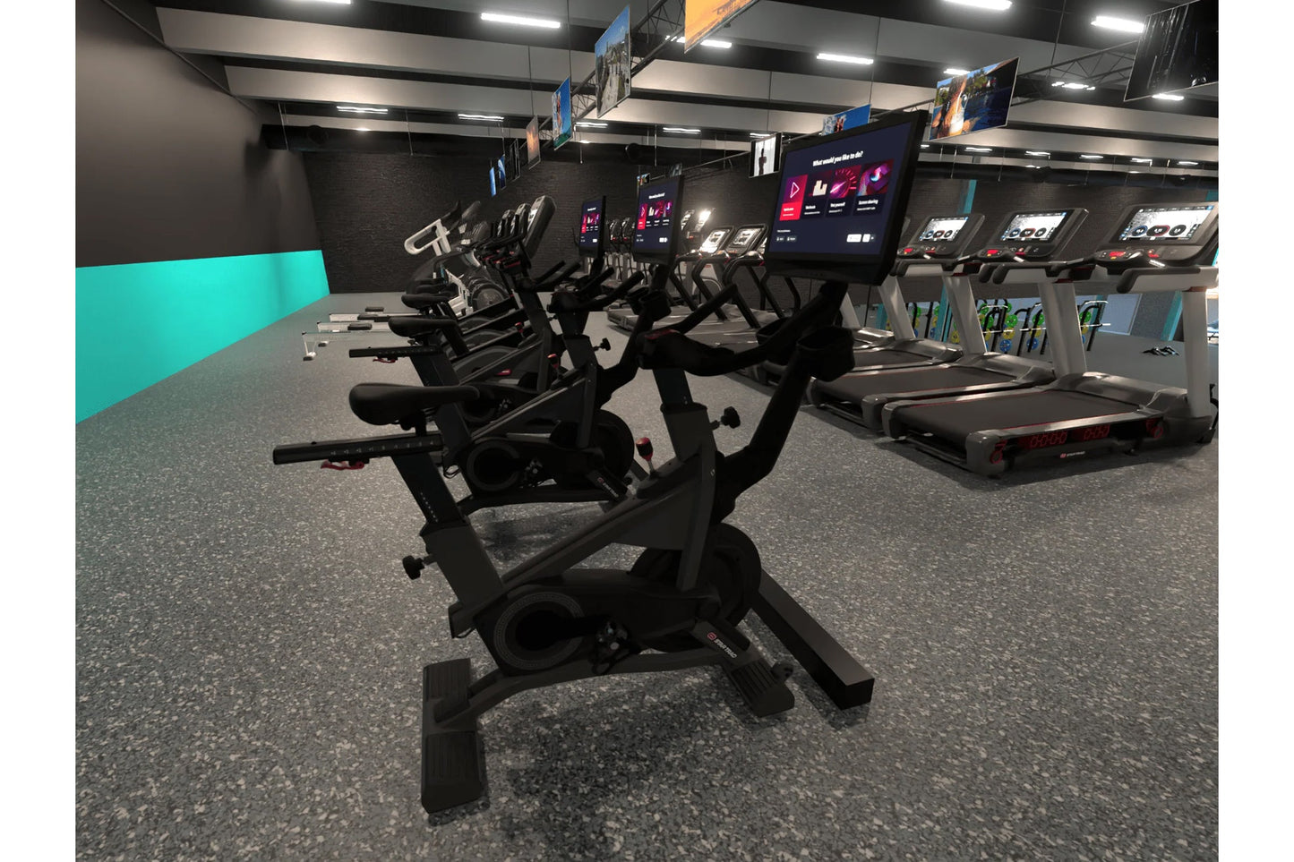 Black stationary exercise bike with digital display in modern gym setting with teal accent wall and equipment visible in back