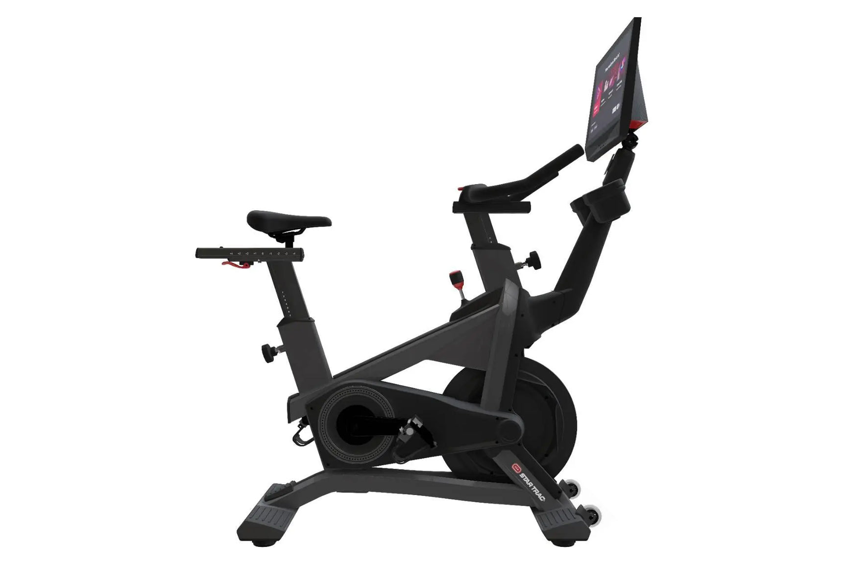 Black stationary exercise bike with tablet display showing pink interface, adjustable seat and handlebars, on white backgroun