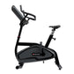Black and gray upright exercise bike with digital display console, adjustable seat, and handlebar grips on white background