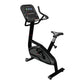 Black upright exercise bike with digital touchscreen console, handlebars, and black seat on white background