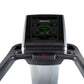 Freemotion t10.9 Interval REFLEX treadmill with digital console displaying green LED readout, black handles, and silver base 