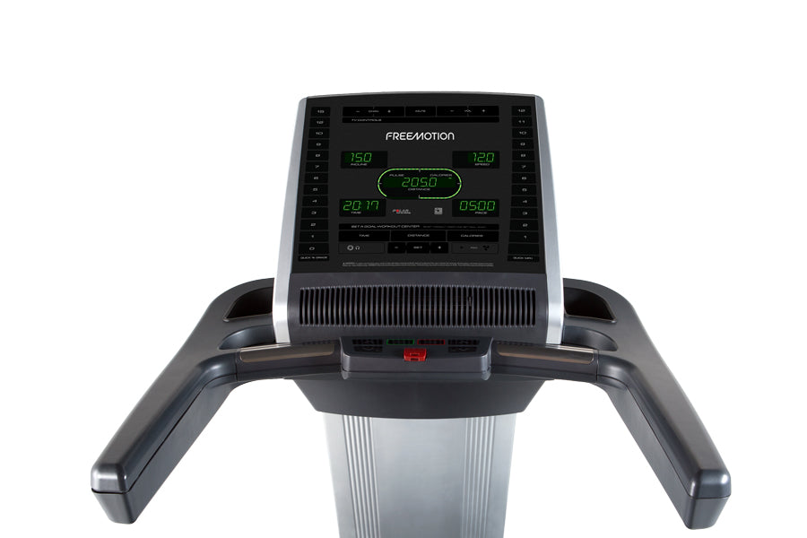 Freemotion t10.9 Interval REFLEX treadmill with digital console displaying green LED readout, black handles, and silver base 
