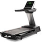 Black and silver motorized treadmill with digital display console showing green fitness metrics