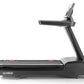 Black motorized treadmill with digital display console, red accent marks on running belt, and adjustable incline arm on white