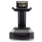 Black Freemotion t22.9 REFLEX treadmill with digital touchscreen display mounted on elevated stand, front view on white backg