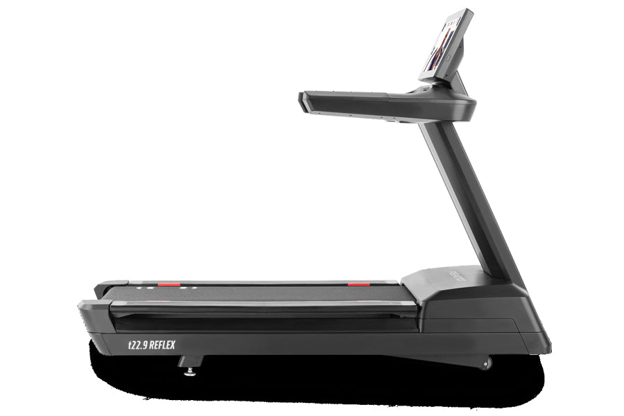 Black motorized treadmill with digital display console and adjustable running deck on white background