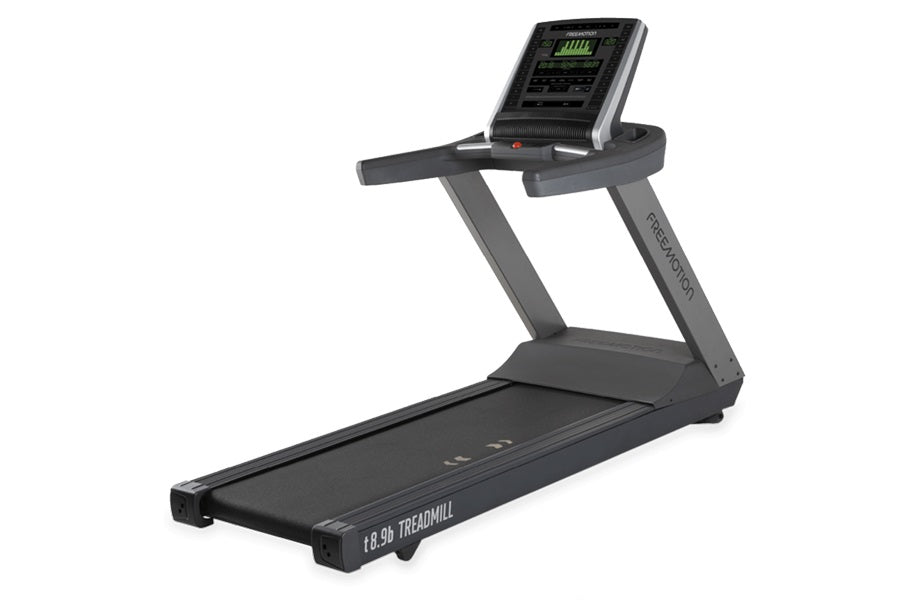 Dark gray commercial treadmill with digital display console, cushioned running belt, and sturdy frame on white background