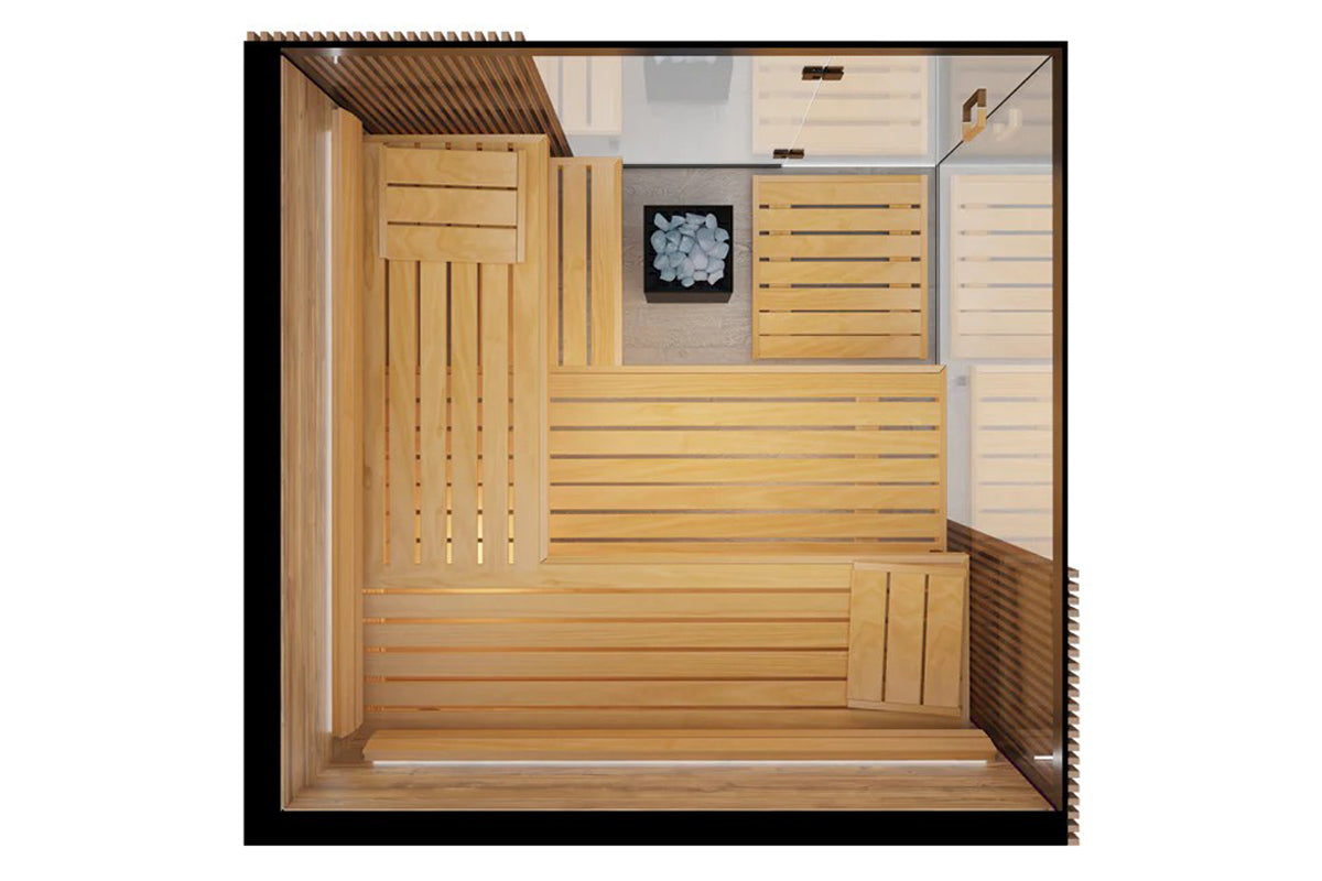 Overhead view of wooden indoor sauna interior with horizontal and vertical slat walls, bench seating, heater compartment, and