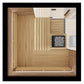 Overhead view of wooden sauna interior with cedar paneling, bench seating, black heater stove with rocks, and ventilation sys